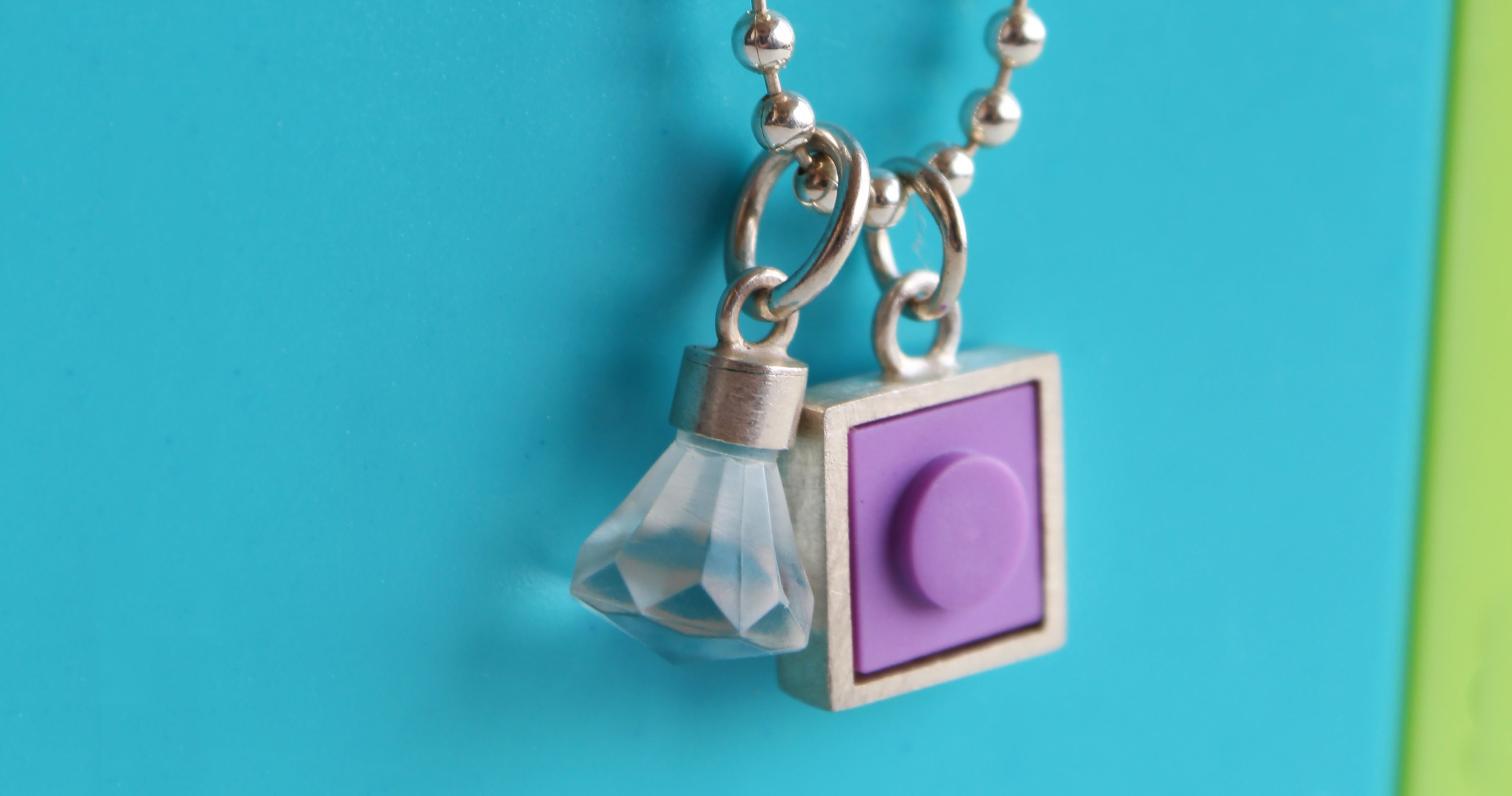 purple lego charm on necklace