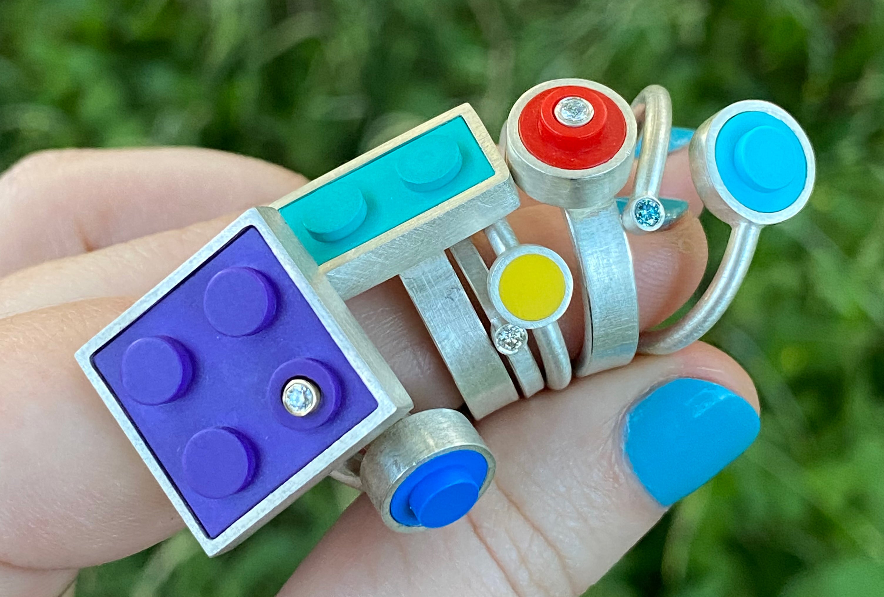 a bunch of multi colored lego rings