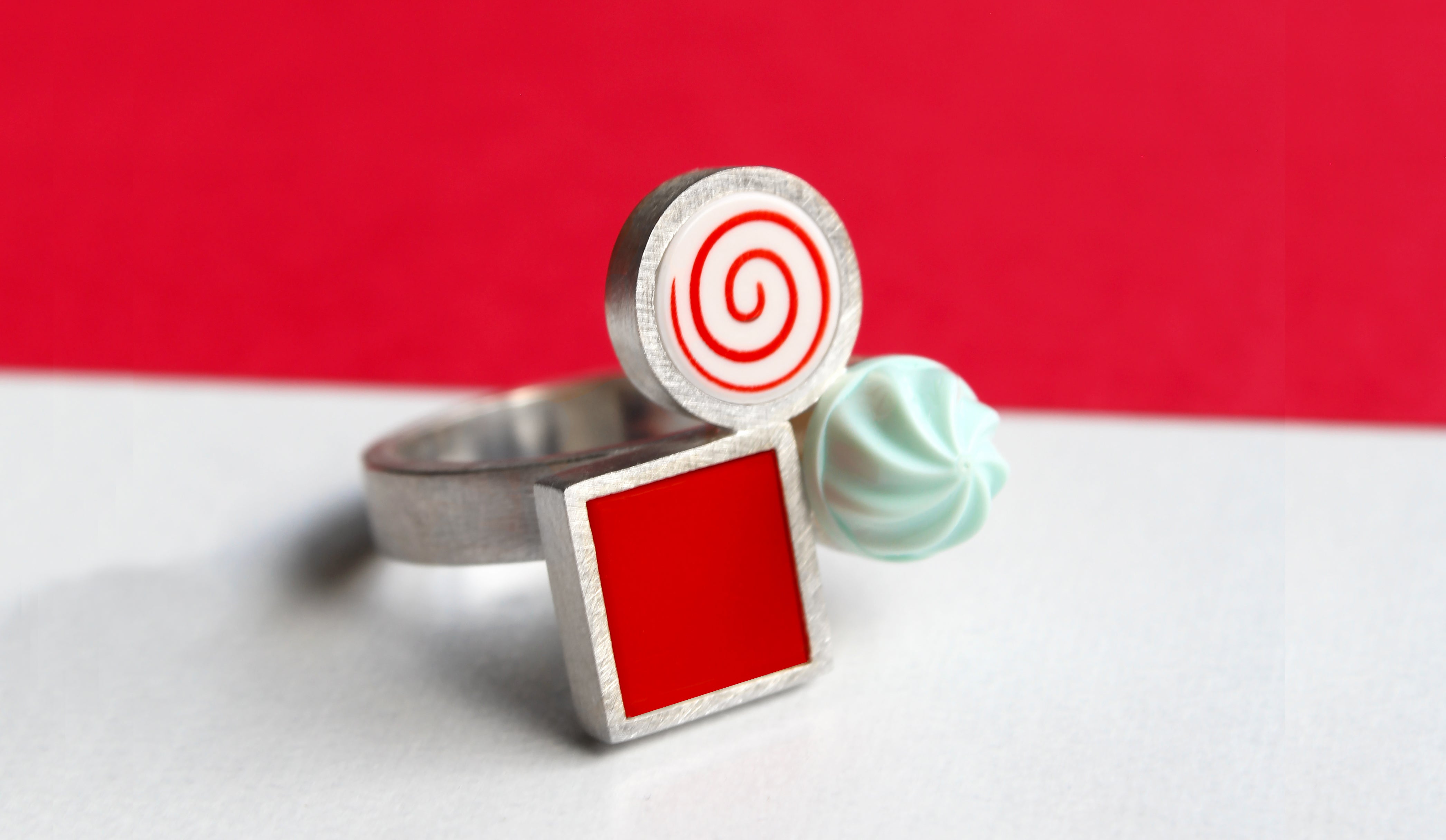 Colorful red ring made from lego pieces.