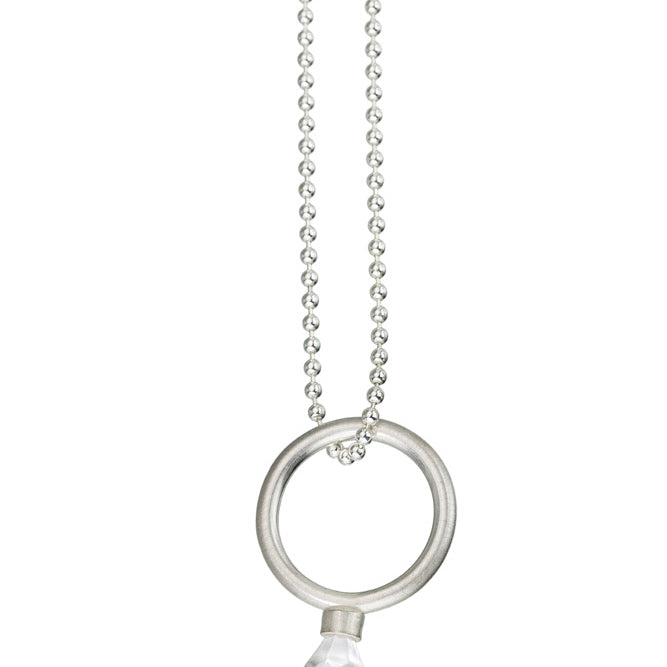 Sterling silver ring with round band and LEGO toy gem on top hanging off of a sterling silver bead chain