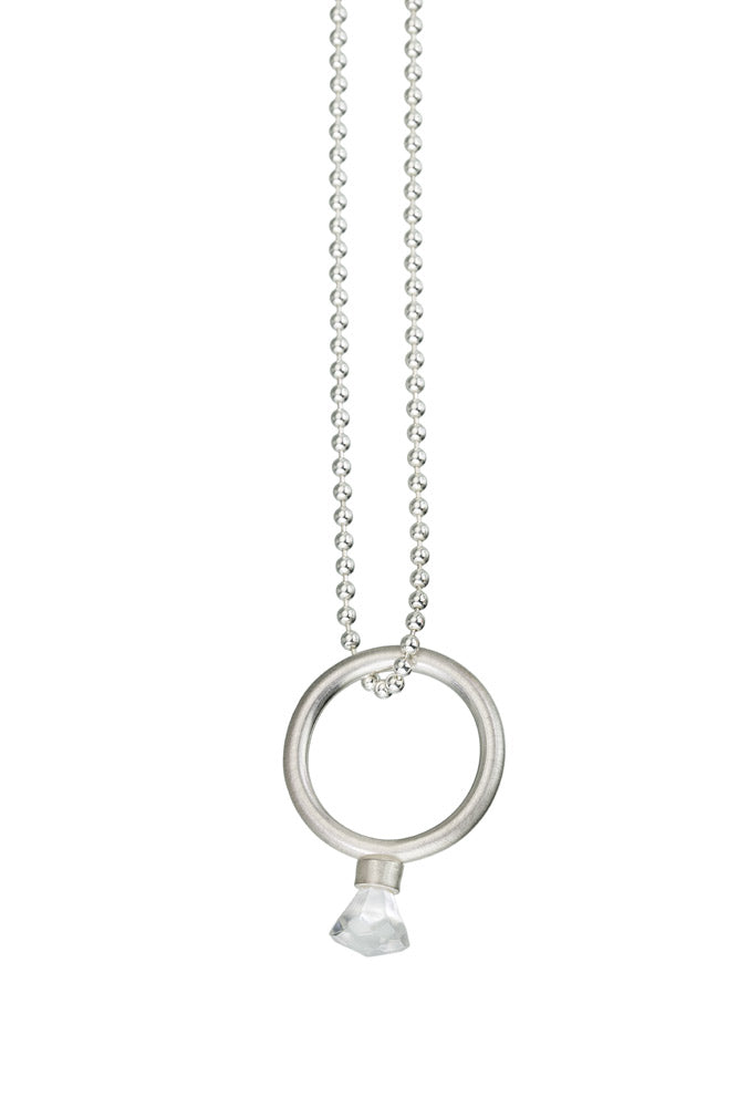 Sterling silver ring with round band and LEGO toy gem on top hanging off of a sterling silver bead chain