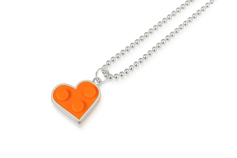 Orange heart shaped  LEGO pendant on silver chain