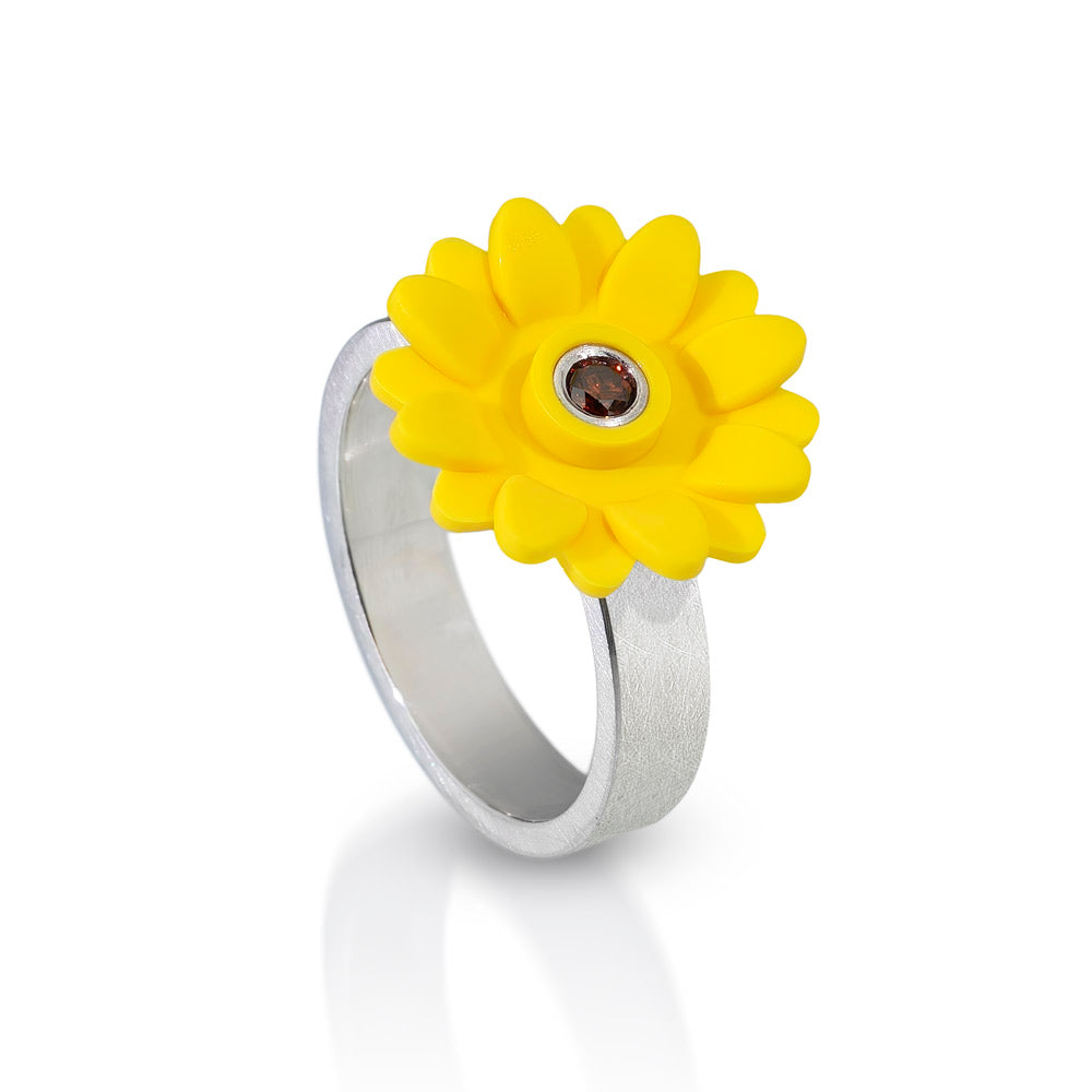 Plastic yellow sunflower on top of a sterling silver ring with a brown diamond in the center of the sunflower set in sterling silver