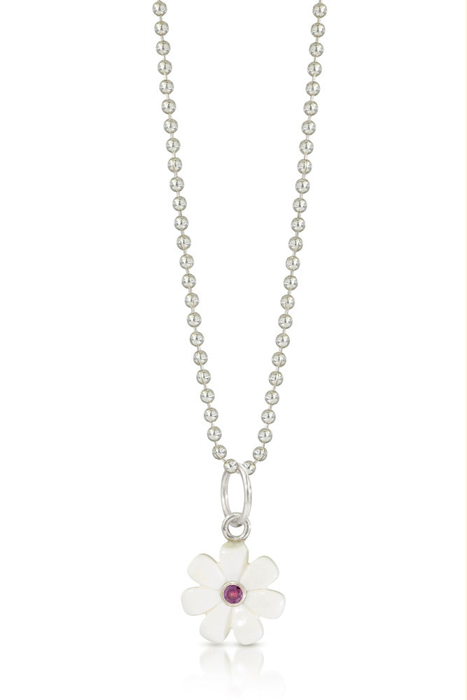 small white lego flower  charm with a purple diamond set into the center. silver ring at top going through a bead necklace