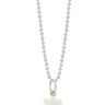 Small white lego flower charm with a black diamond in the center hanging on a bead chain