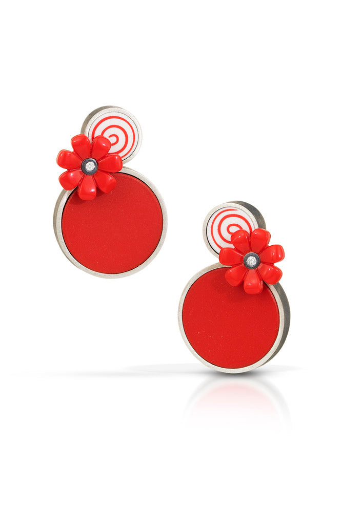 Circle on top with a red and white candy swirl design with a red flower below it with a diamond set into it- on top of a larger red dot