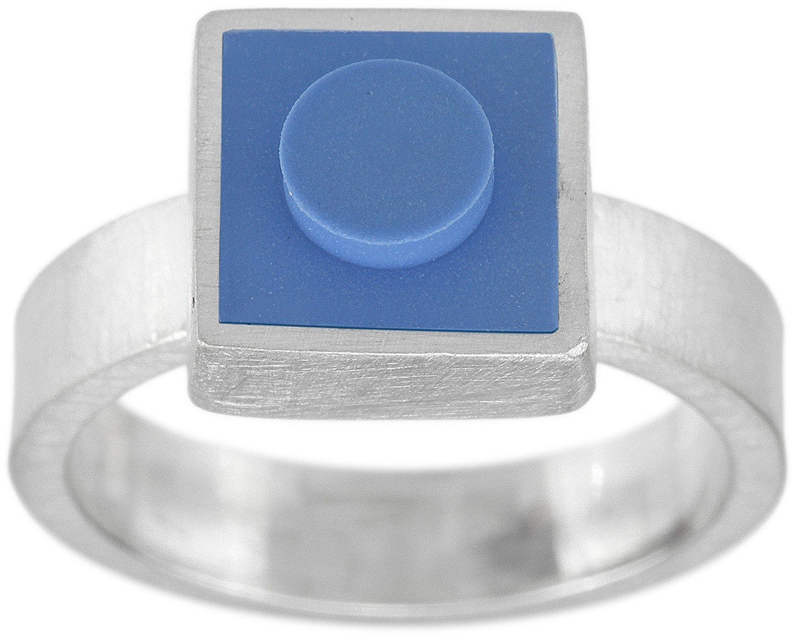 Light blue 1 X 1 square LEGO set into a bezel on top of a ring