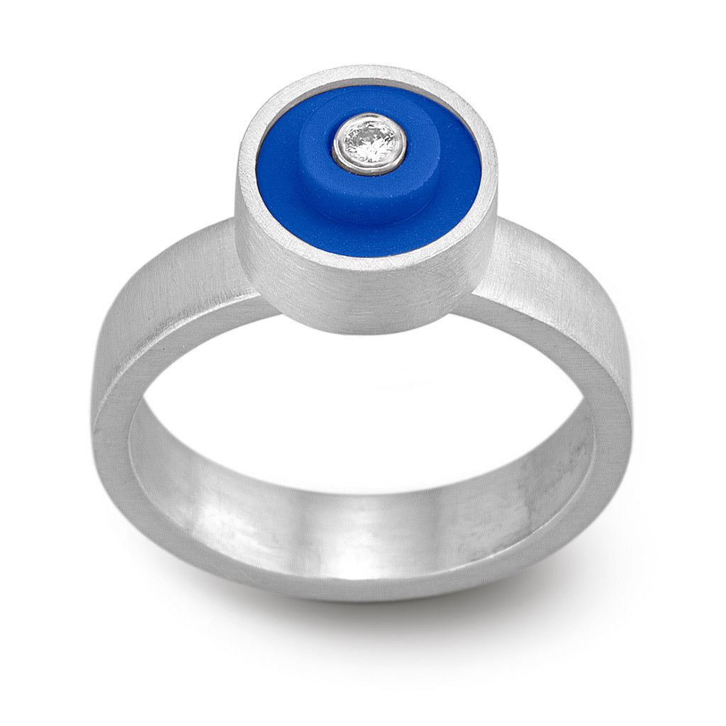 Ring with a bright blue round lego dot on top with a diamond set into the center