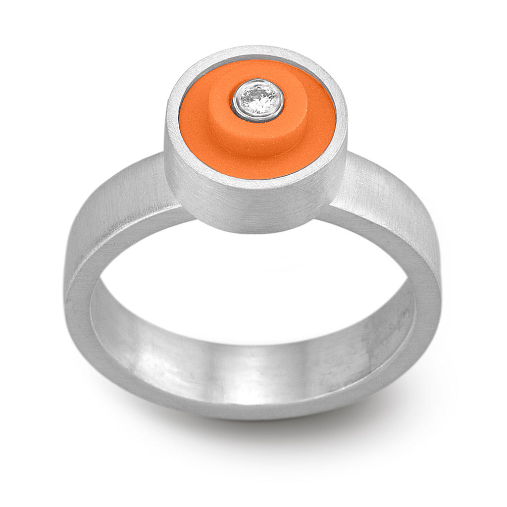 Ring with an orange round lego dot on top with a diamond set into the center