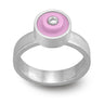 Ring with a light pink round lego dot on top with a diamond set into the center
