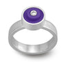 Ring with a purple round lego dot on top with a diamond set into the center