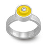 Ring with a yellow round lego dot on top with a diamond set into the center