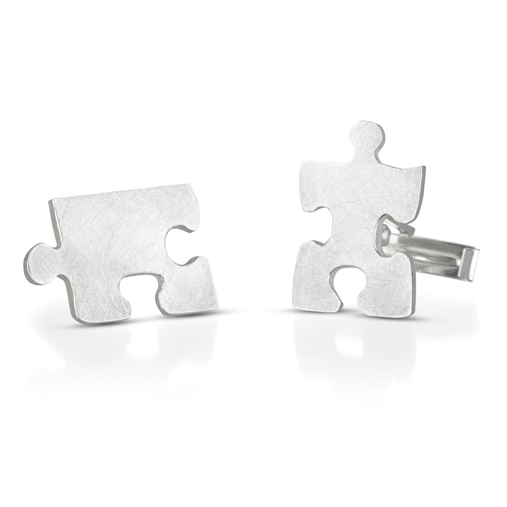 Autism awareness puzzle piece cuff links shown apart