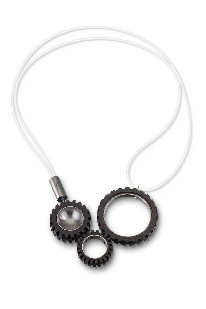 Funky necklace with 3 LEGO Truck tires with hand fabricated sterling silver tube clasp