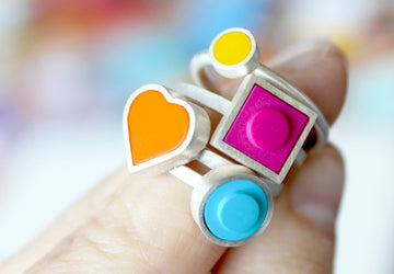 4 bright lego rings stacked