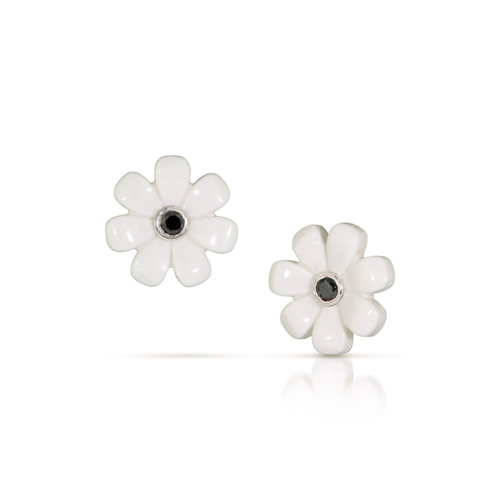 White LEGO flowers with black diamonds  set in the middle