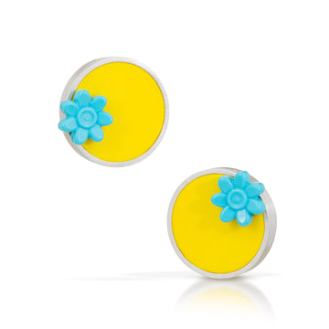 Yellow Lego round flat tile made into modern earrings with a turquoise logo trolls flower on opposite side of each circle.