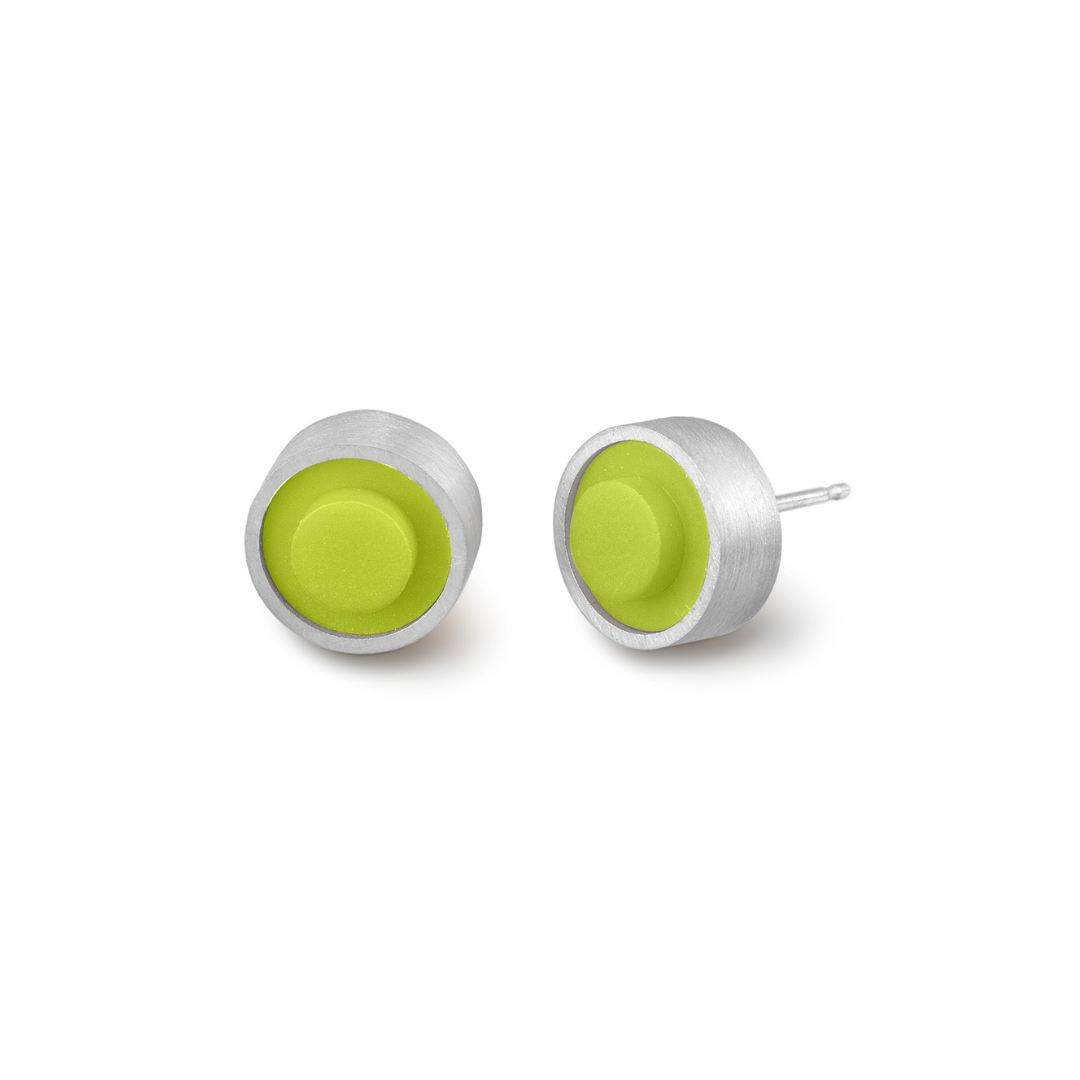 Pair of round green LEGO dot earrings set into silver on a white background