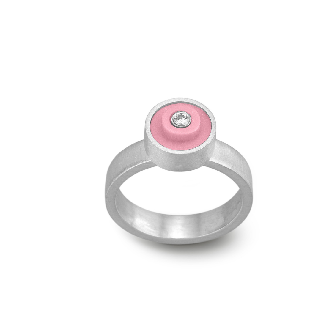 Sterling silver handmade ring with a light pink round lego dot on top with a diamond set into the center