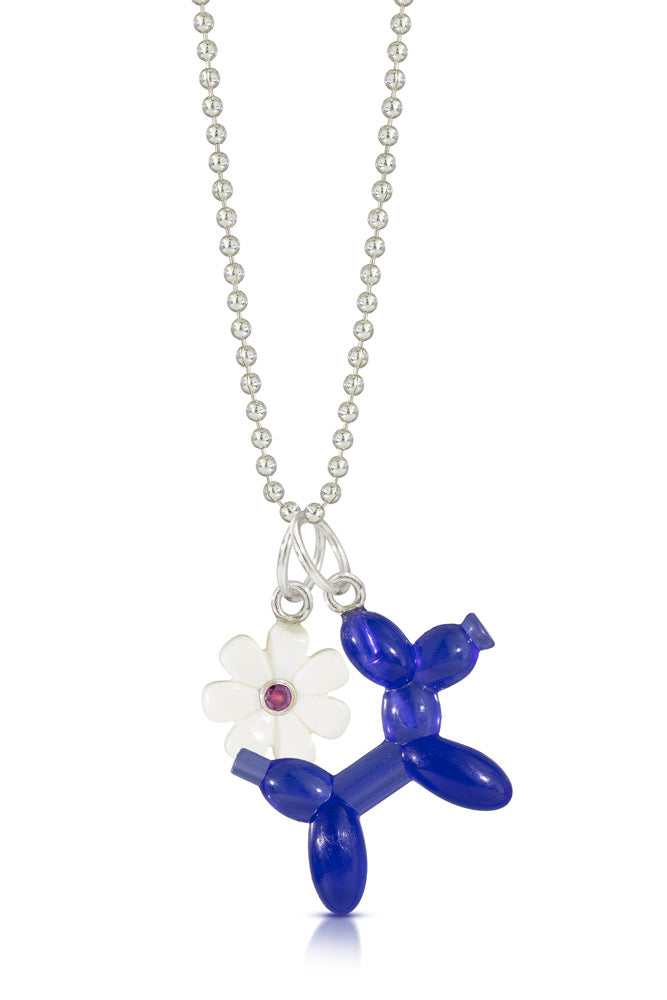 blue lego balloon dog that looks like Jeff Koons sculpture charm hanging on a chain with a white lego flower with a purple diamond in the middle 
