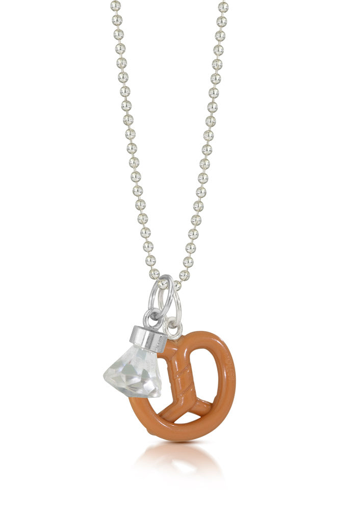 Lego toy gem with silver on top to make into a charm hanging off a chain with a lego toy pretzel