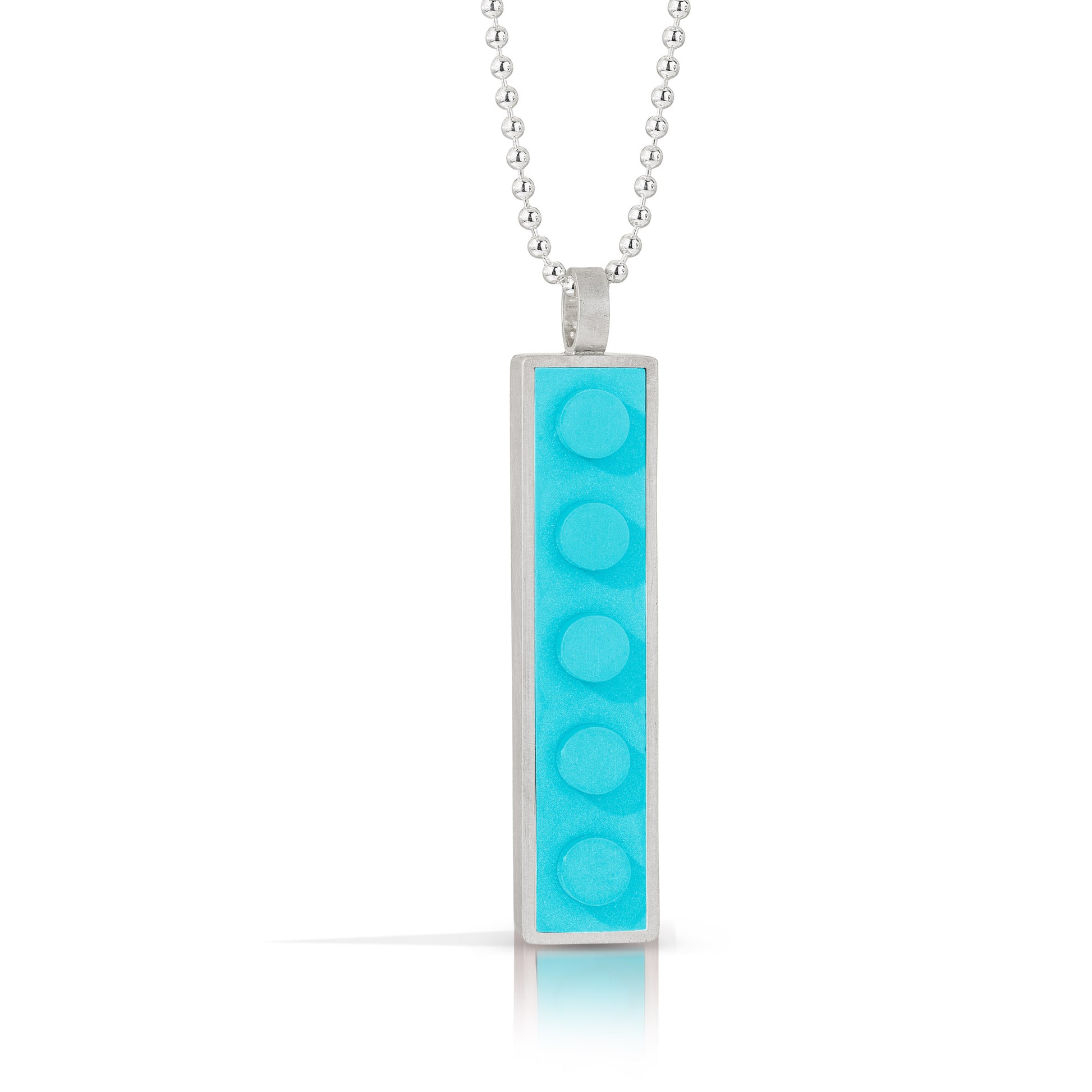 Turquoise 1 X 5 LEGO brick pendant  set into sterling silver hanging off a bead necklace