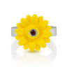 Yellow sunflower  mounted on top of a silver band with a brown diamond set in the center