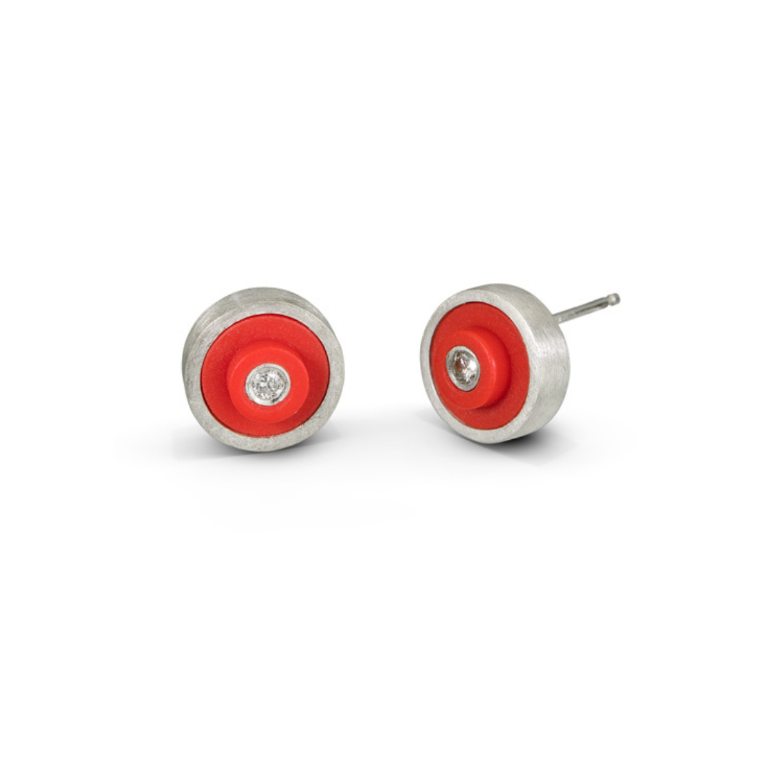 Pair of silver earrings with red LEGO dots that have a diamond set into each center