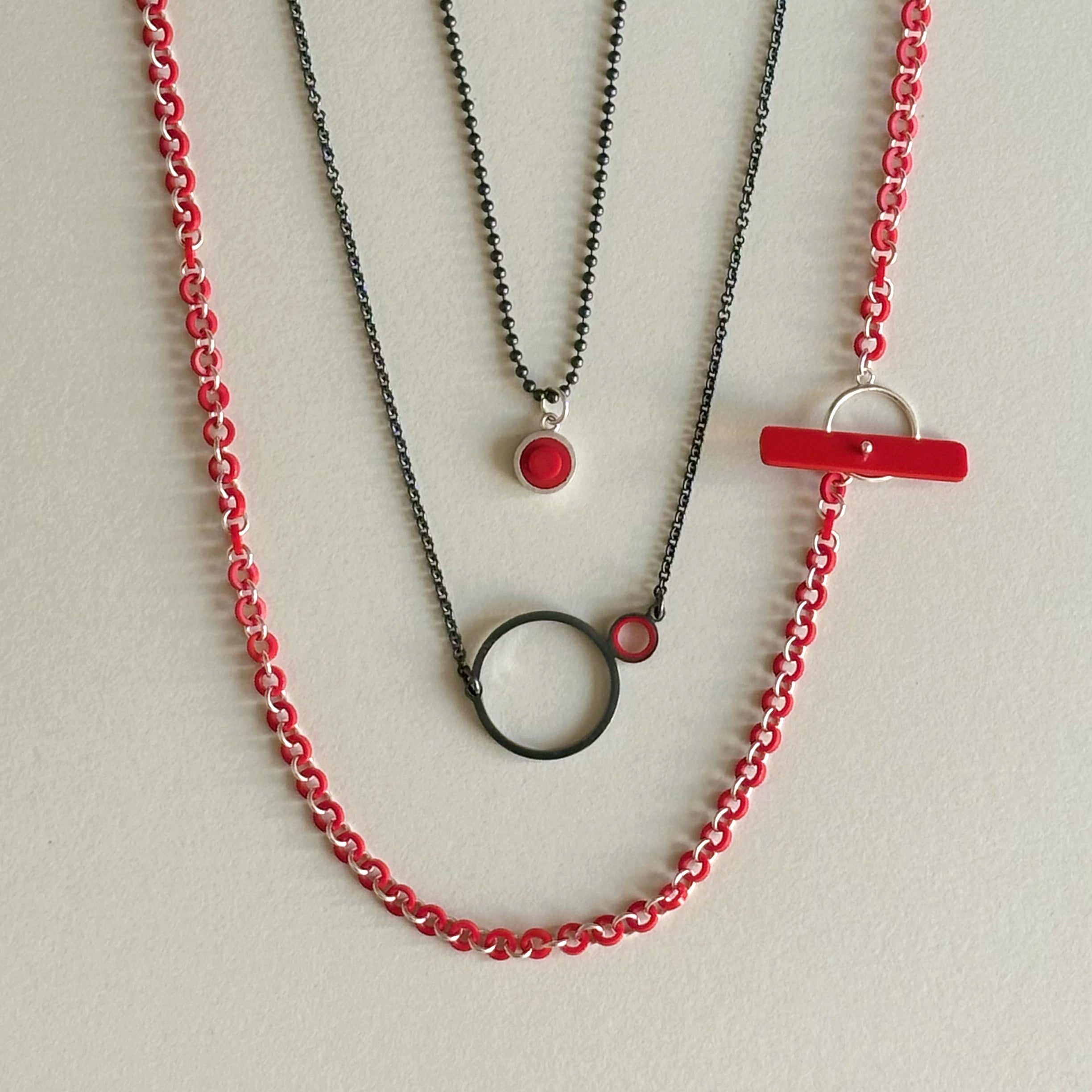 3 necklace arranged  within each other to show how they lay together  with a little ditance between each on the body