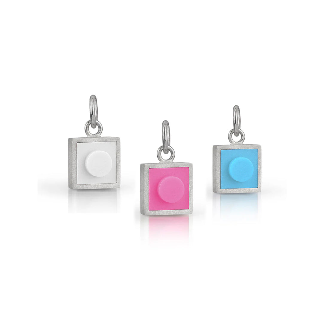 3 sguare LEGO charms in white, pink, and blue set into sterling silver 