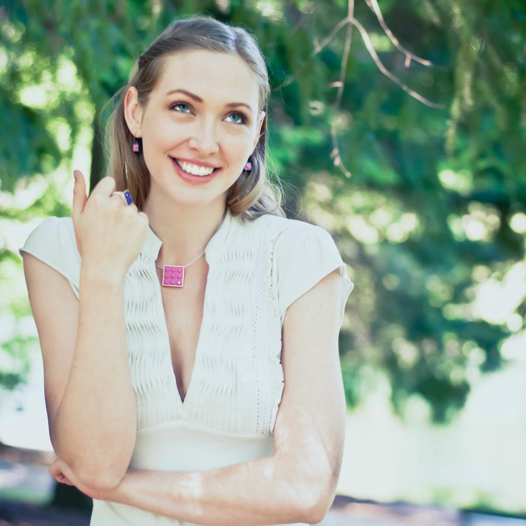 2 X 3 pink recycled LEGO brick hand made into a  modern, simplistic pendant with a diamond