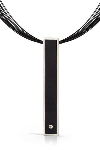 Contemporary, art jewelry, stainless steel cord necklace with black LEGO bar pendant with diamond