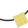 Yellow LEGO plate made into pendant with diamond set into sterling silver on rubber cord